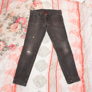 Uniqlo black super skinny jeans w/ animal patches